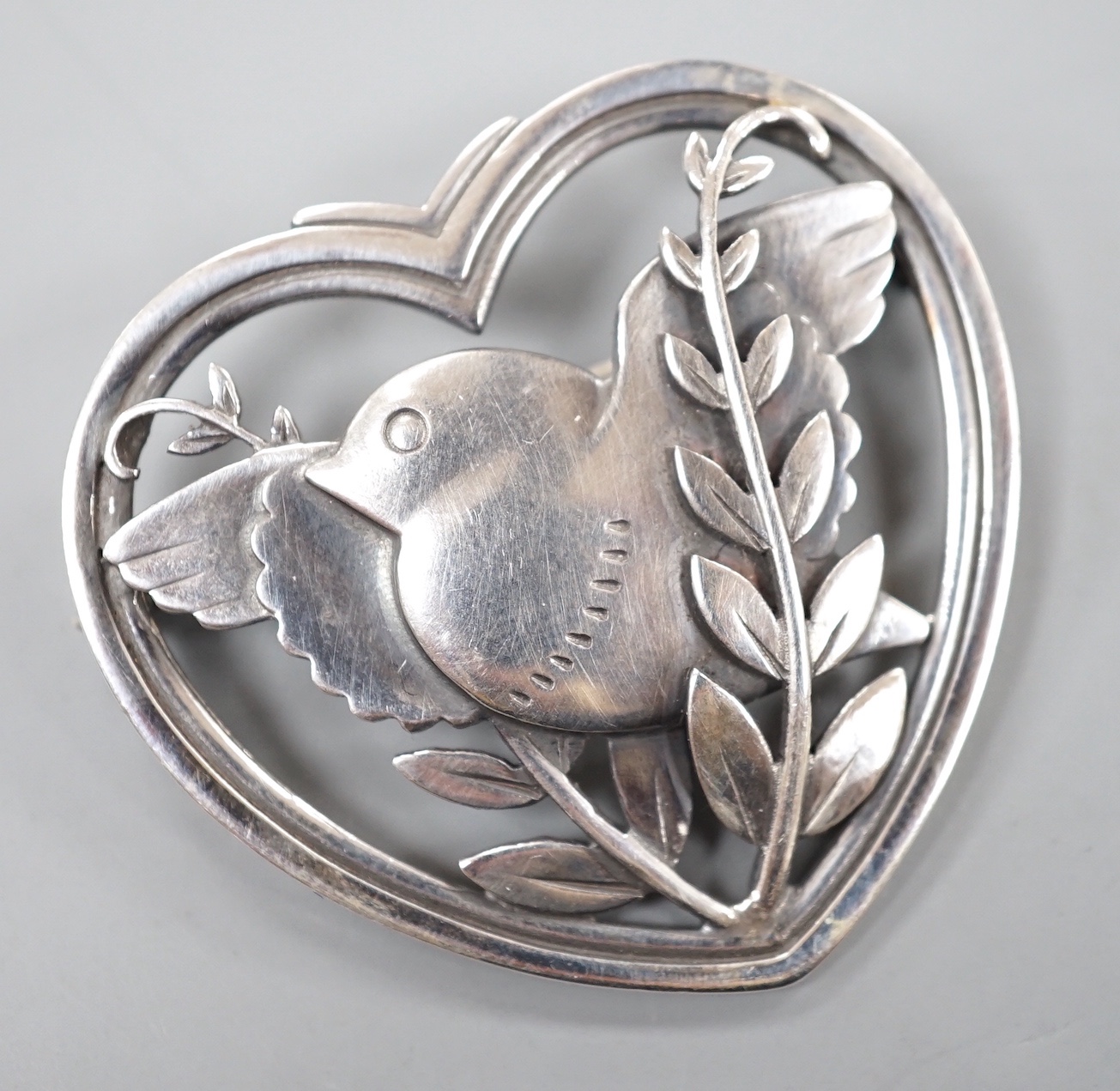 A Georg Jensen heart shaped 'robin with frond' brooch, no. 239, 38mm.